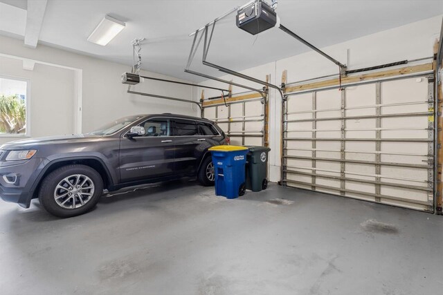 garage featuring a garage door opener