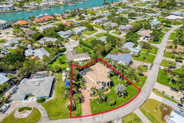 aerial view with a water view and a residential view