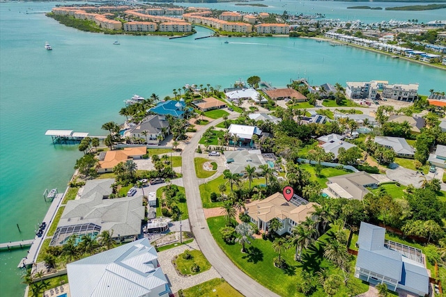 birds eye view of property with a residential view and a water view