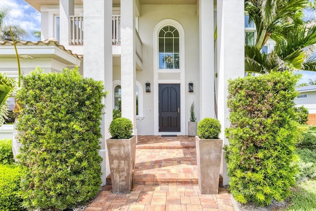 doorway to property with stucco siding