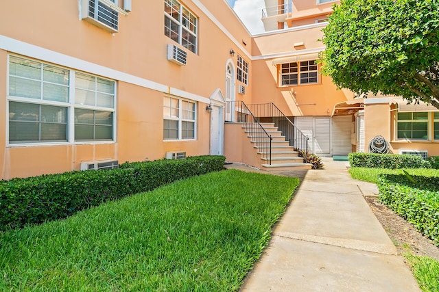 31 S Golfview Rd # 11, Lake Worth Beach, FL 33460 - view of property with central AC, stairs, and a wall mounted air conditioner