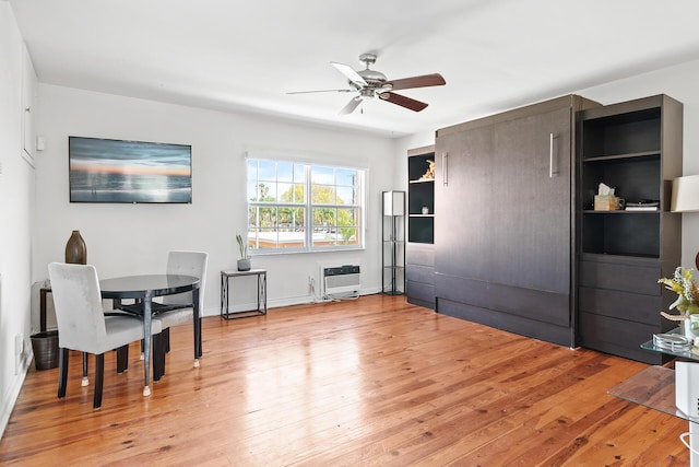 31 S Golfview Rd # 11, Lake Worth Beach, FL 33460 - dining area featuring heating unit, baseboards, ceiling fan, and light wood finished floors
