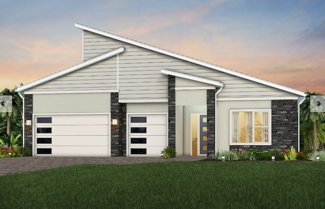 10822 Stellar Cir Unit Renown 26, Palm Beach Gardens, FL 33412 - contemporary home featuring stone siding, an attached garage, a front yard, and driveway