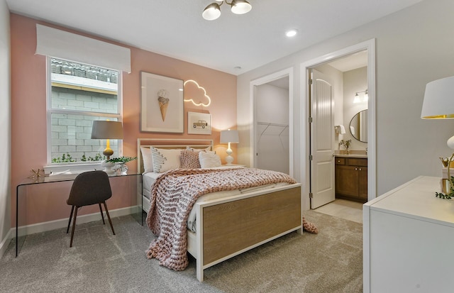 10822 Stellar Cir Unit Renown 26, Palm Beach Gardens, FL 33412 - bedroom featuring light colored carpet, ensuite bath, and baseboards