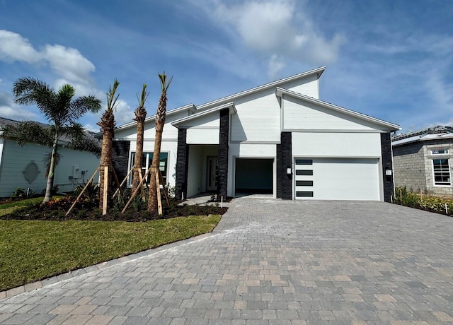 10822 Stellar Cir Unit Renown 26, Palm Beach Gardens, FL 33412 - view of front of property featuring decorative driveway and a garage