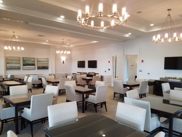 dining area with recessed lighting, ornamental molding, visible vents, a raised ceiling, and a notable chandelier