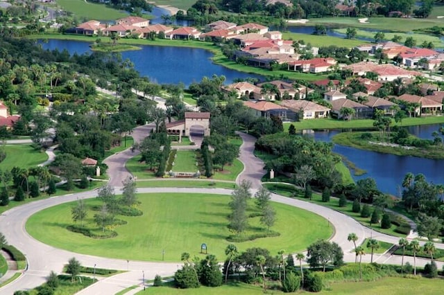 bird's eye view with a residential view and a water view