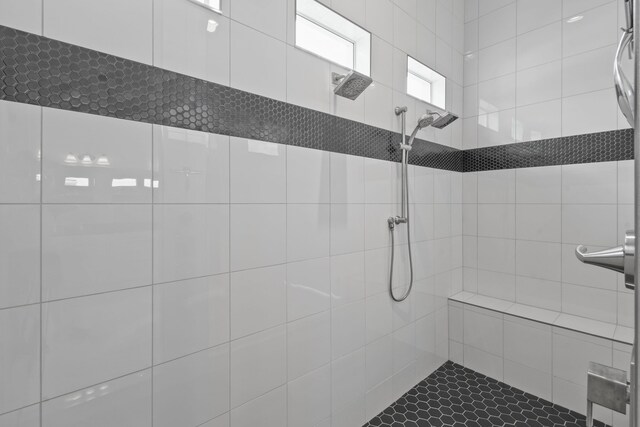bathroom featuring tiled shower