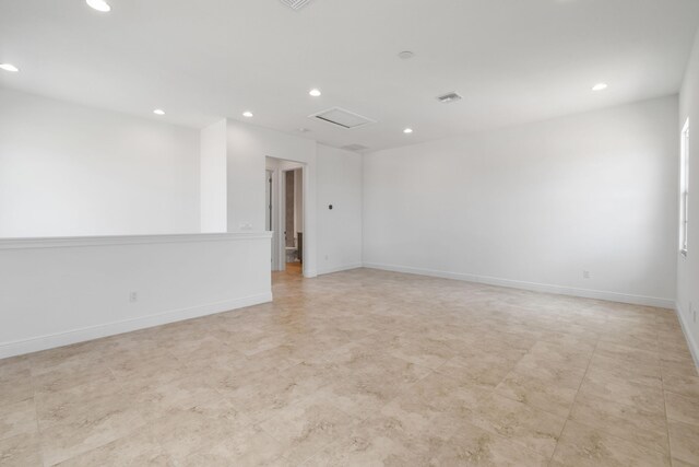 unfurnished room with baseboards, recessed lighting, and visible vents