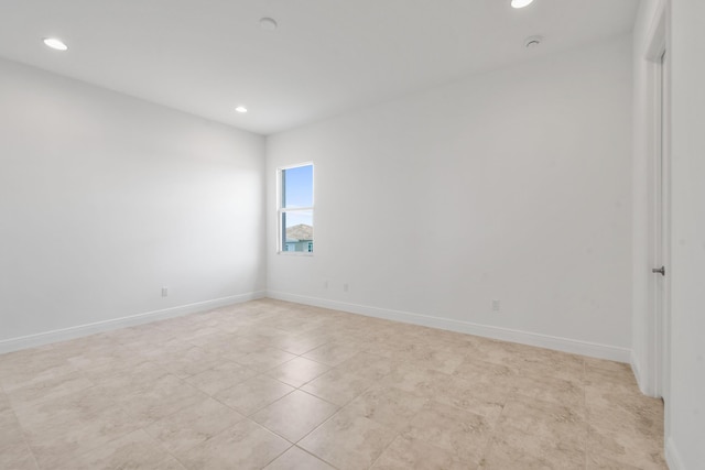 unfurnished room featuring light tile patterned flooring, recessed lighting, and baseboards