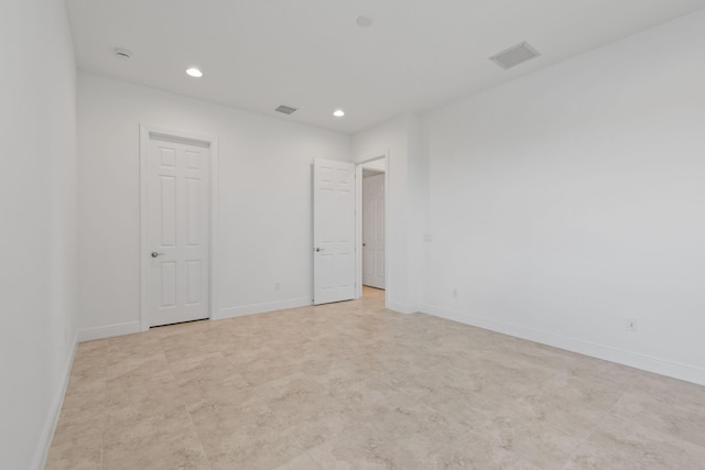 unfurnished bedroom featuring recessed lighting, visible vents, and baseboards