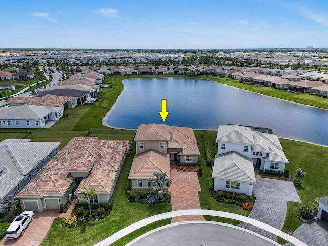 bird's eye view featuring a residential view and a water view