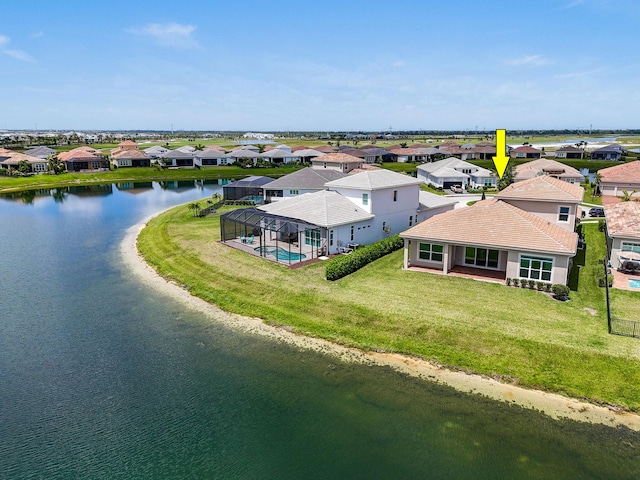 aerial view with a residential view and a water view