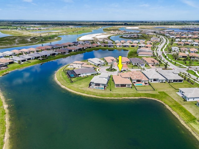 birds eye view of property with a residential view and a water view