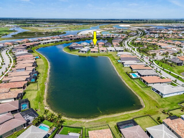 aerial view with a water view and a residential view