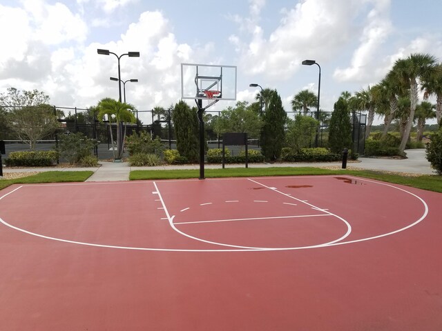 view of sport court featuring fence and community basketball court