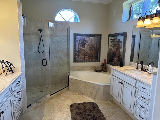 ensuite bathroom featuring toilet, baseboards, ensuite bathroom, tile patterned floors, and vanity