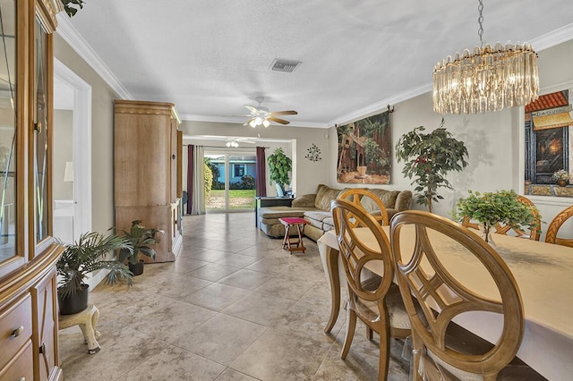 dining area with visible vents, ceiling fan with notable chandelier, crown molding, and light tile patterned flooring