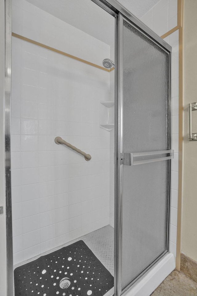bathroom featuring a stall shower