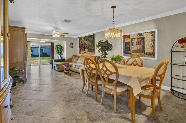 dining room featuring visible vents, ceiling fan with notable chandelier, and crown molding