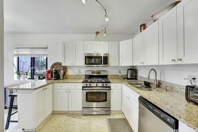 5337 Fountains Dr S, Lake Worth, FL 33467 - kitchen featuring white cabinets, stainless steel appliances, and a sink