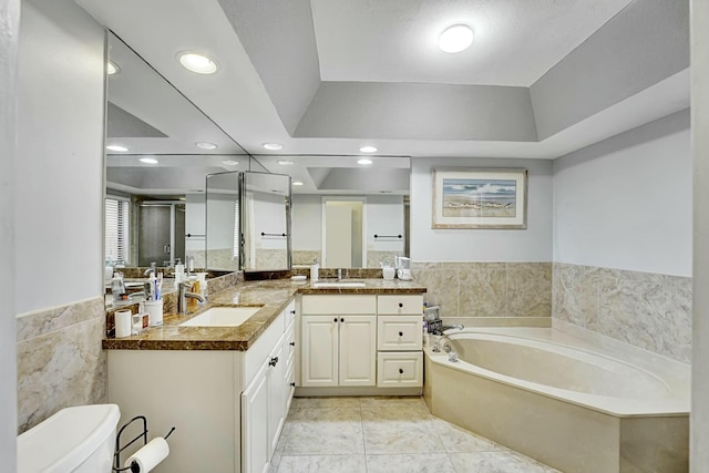 5337 Fountains Dr S, Lake Worth, FL 33467 - full bathroom with a shower stall, a garden tub, vanity, tile walls, and toilet