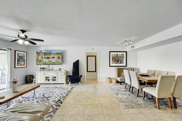 5337 Fountains Dr S, Lake Worth, FL 33467 - living room with rail lighting, a textured ceiling, ceiling fan, and visible vents