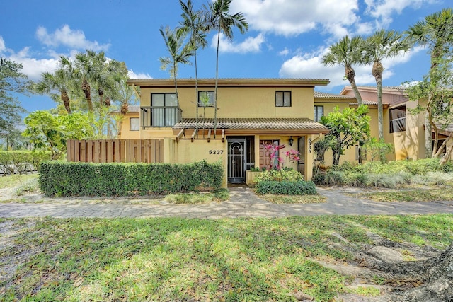 5337 Fountains Dr S, Lake Worth, FL 33467 - traditional-style house featuring a tile roof and stucco siding