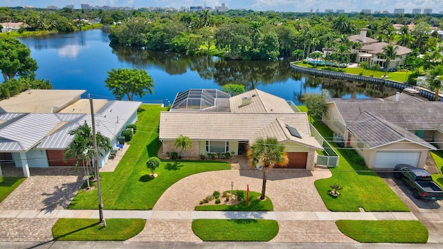 bird's eye view featuring a residential view, a water view, and a view of city