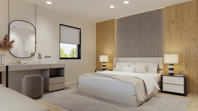 bedroom with recessed lighting, wooden walls, wood finished floors, and baseboards