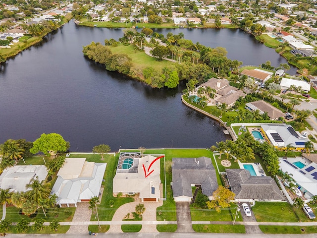 drone / aerial view with a residential view and a water view