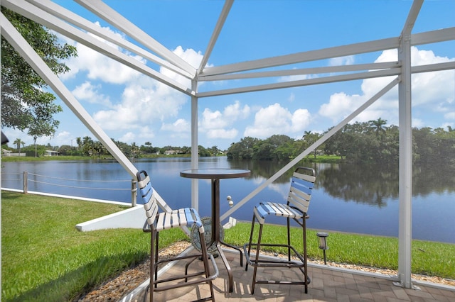 unfurnished sunroom featuring a water view