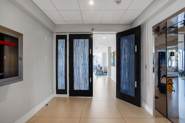 1180 S Ocean Blvd Unit 11D, Boca Raton, FL 33432 - foyer with a paneled ceiling, baseboards, and tile patterned floors