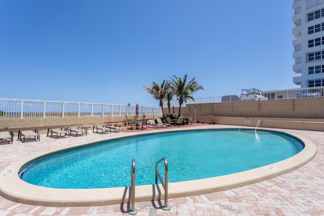 1180 S Ocean Blvd Unit 11D, Boca Raton, FL 33432 - community pool with fence and a patio