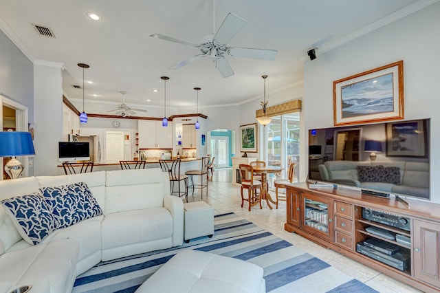 living room with ceiling fan, recessed lighting, light tile patterned floors, and crown molding