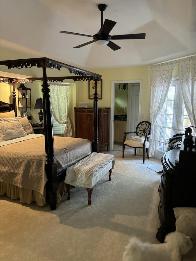 bedroom featuring carpet floors, lofted ceiling, and a ceiling fan