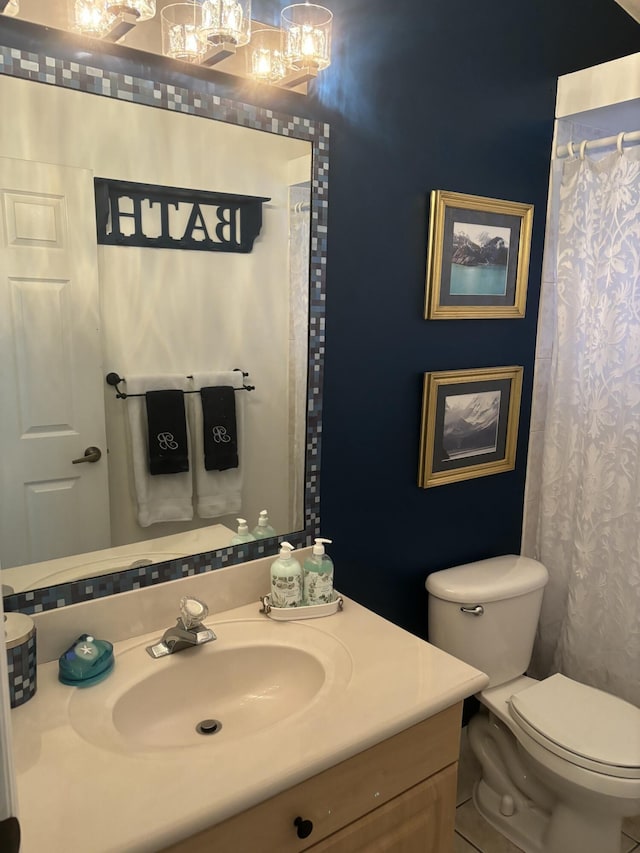 full bathroom with vanity and toilet