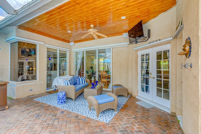 view of patio / terrace with french doors, ceiling fan, and outdoor lounge area