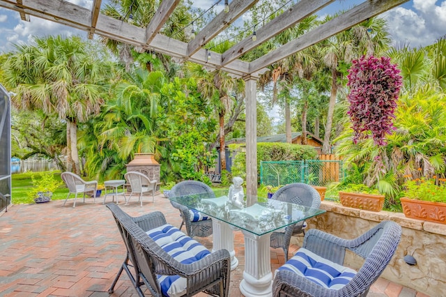 view of patio / terrace with outdoor dining space, a fenced backyard, and a pergola