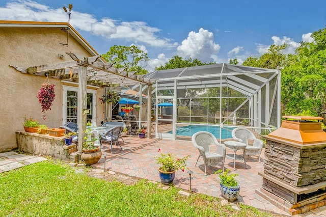 outdoor pool with a pergola, a patio area, and a lanai