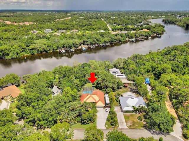 bird's eye view of a nearby body of water and a forest
