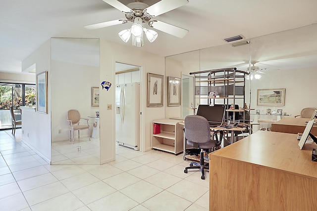 office area with visible vents, ceiling fan, and light tile patterned floors