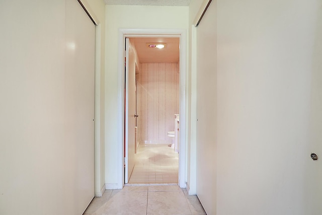 hallway featuring light tile patterned floors