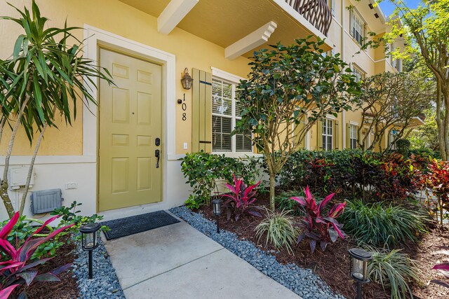 doorway to property with stucco siding