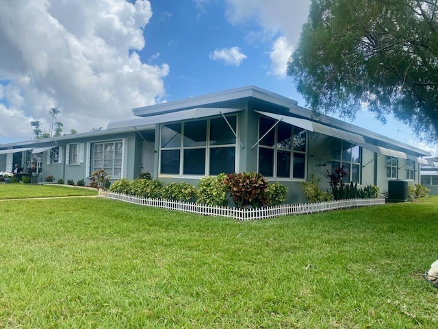 815 Club Dr Unit D, Delray Beach, FL 33445 - rear view of house featuring a yard, stucco siding, and cooling unit