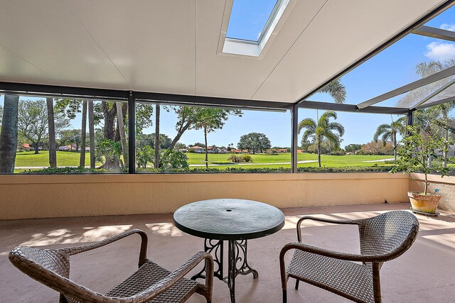 709 Windermere Way, Palm Beach Gardens, FL 33418 - sunroom featuring view of golf course, a skylight, and plenty of natural light