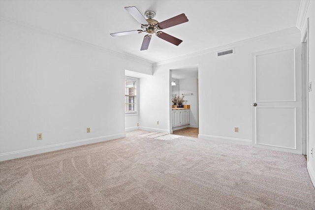1811 SW Palm City Rd Unit A-202, Stuart, FL 34994 - unfurnished bedroom featuring ornamental molding, light carpet, baseboards, ensuite bathroom, and a ceiling fan