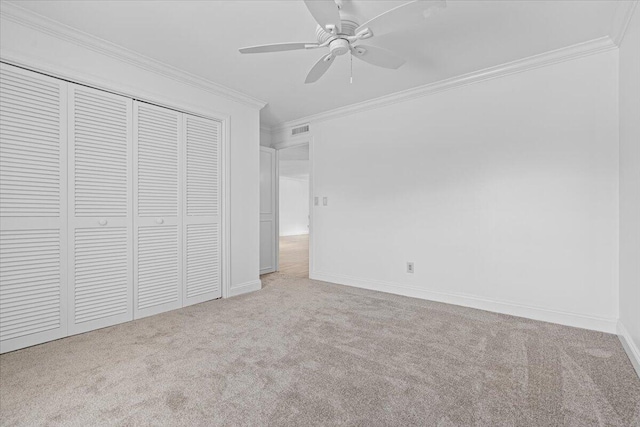 1811 SW Palm City Rd Unit A-202, Stuart, FL 34994 - unfurnished bedroom with carpet, crown molding, baseboards, a closet, and ceiling fan