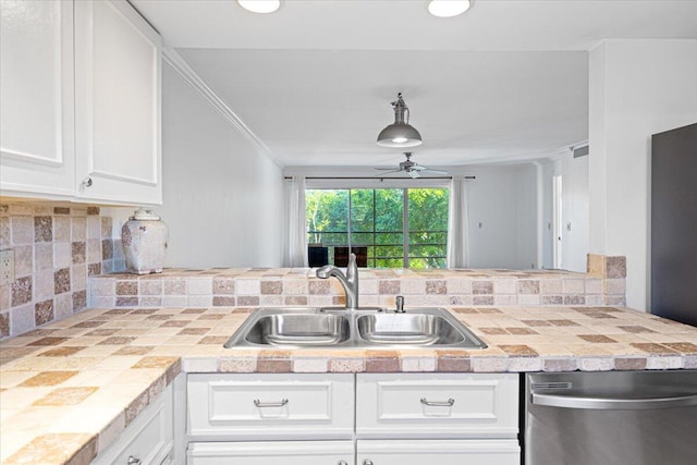 1811 SW Palm City Rd Unit A-202, Stuart, FL 34994 - kitchen featuring dishwasher, a sink, ceiling fan, tasteful backsplash, and crown molding