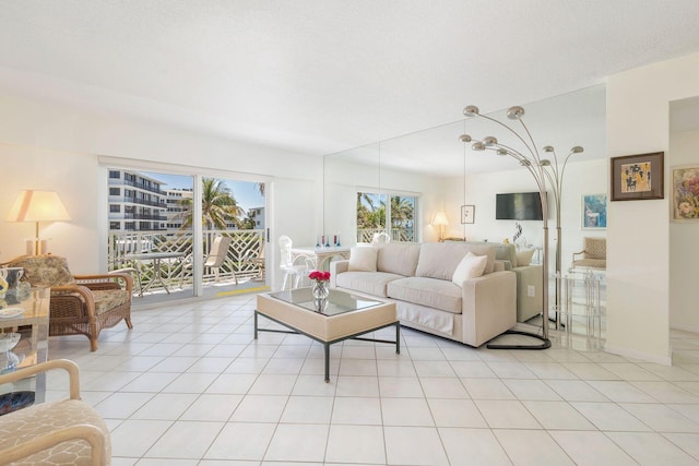 170 N Ocean Blvd Unit 305, Palm Beach, FL 33480 - living room with light tile patterned floors